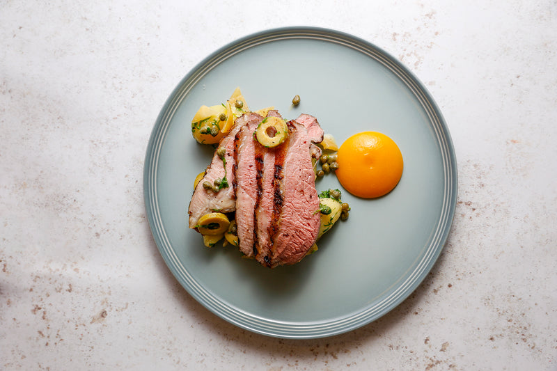 Grilled leg of lamb, warm potato salad and apricot ketchup